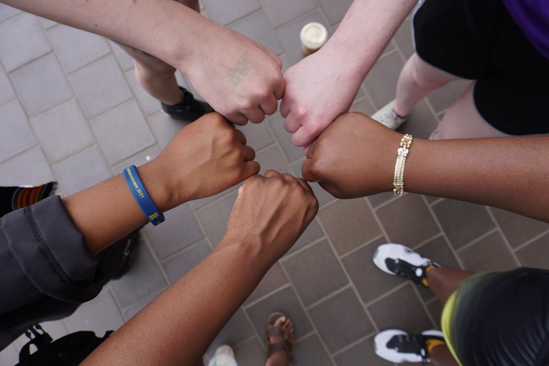Hands gathered together in a group gesture